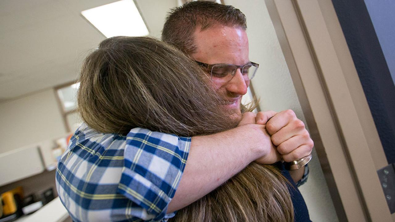 Matthew Savoca and Holly Hatfield hug