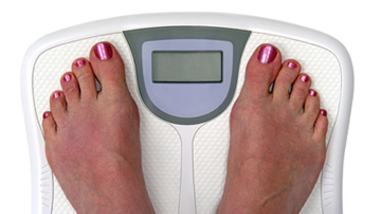 Photo: two bare feet on a scale