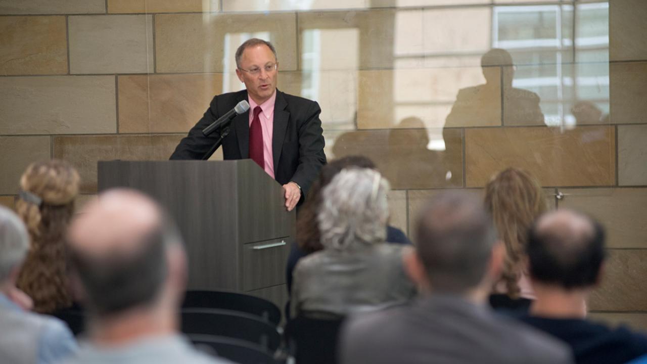 Interim Chancellor Ralph J. Hexter speaks to a crowd.