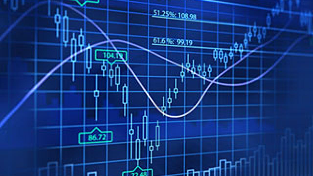 Photo: illuminated board showing stock price swings