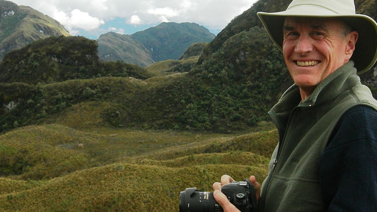 Alexander Harcourt, camera in hand, in the Ecuadorian highlands