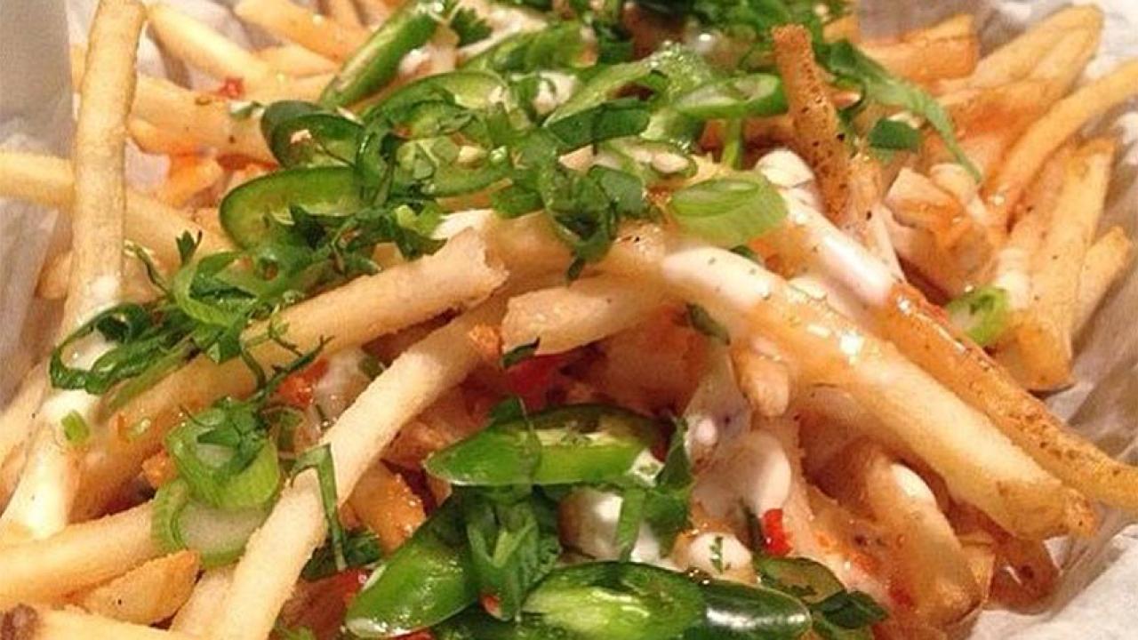 French fries covered in Thai hot peppers