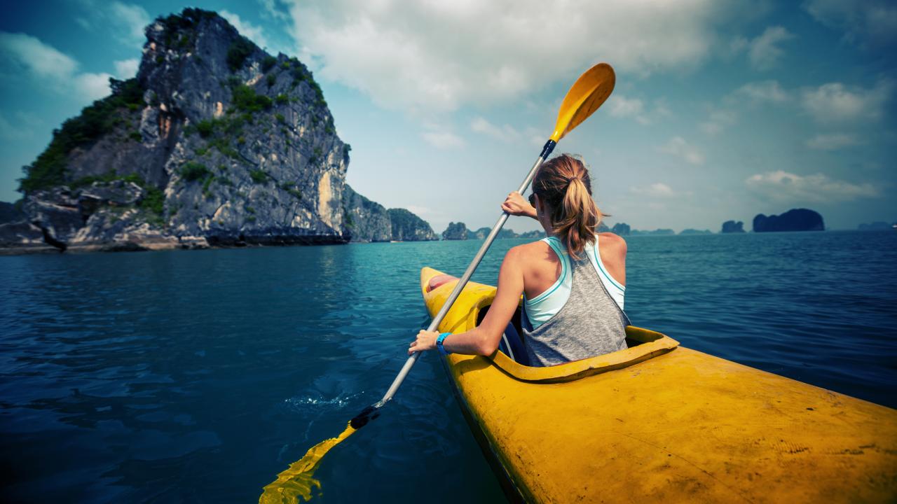 A study abroad student kayaks in Vietnam