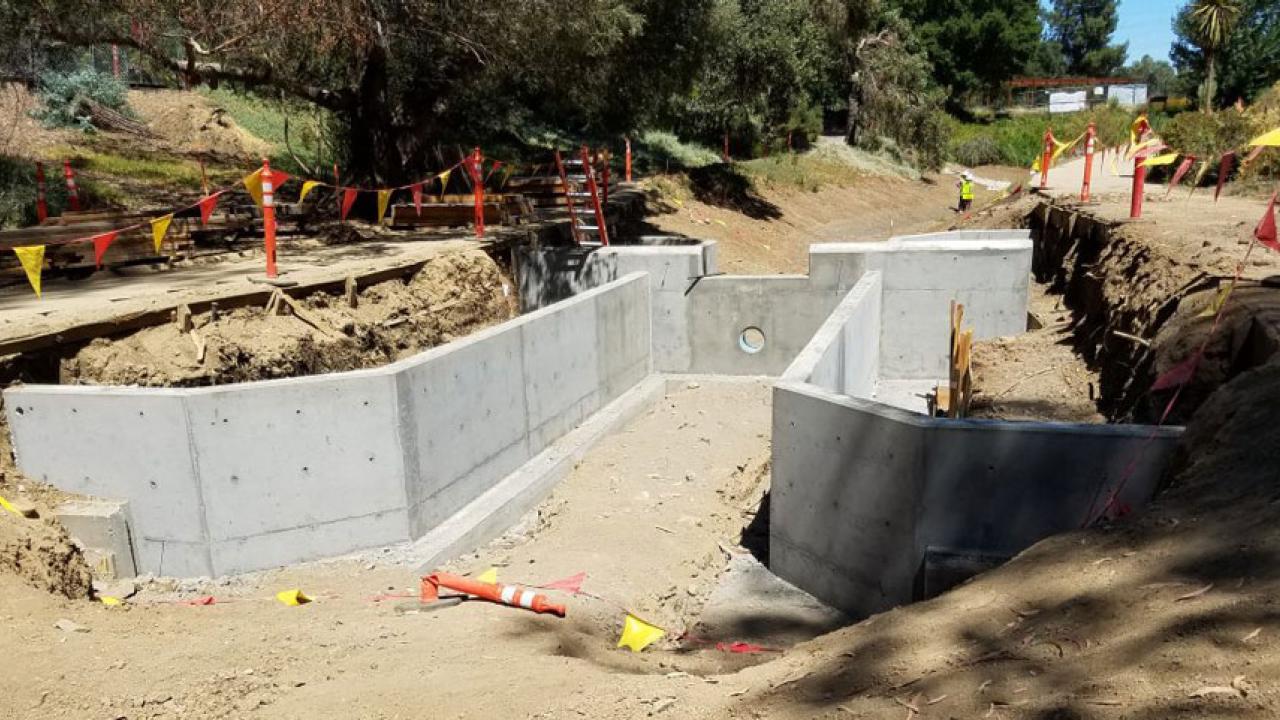 Concrete weir in dry waterway