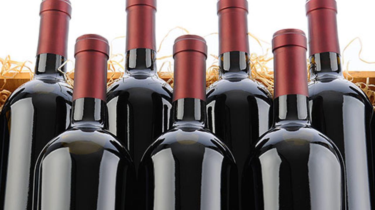 Photo: seven bottles of red wine