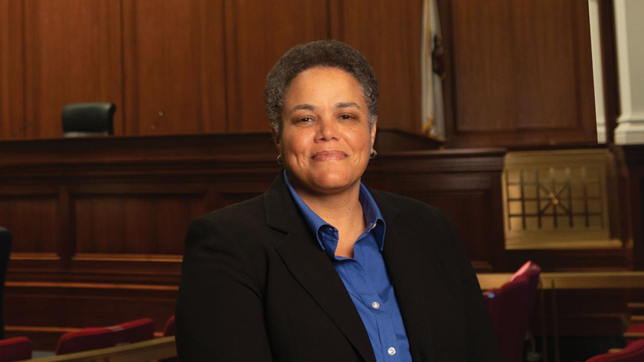 Portrait of Kelli Evans in a courtroom
