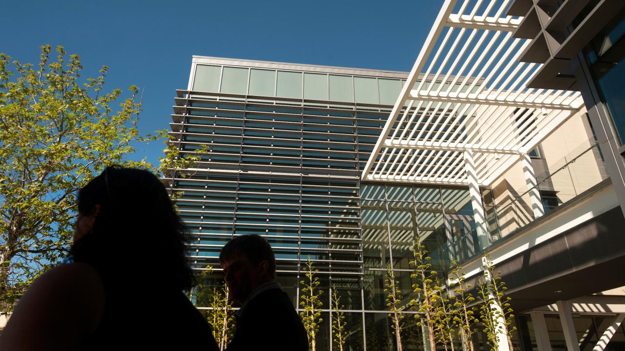 Gallagher Hall, a glass building in shadow