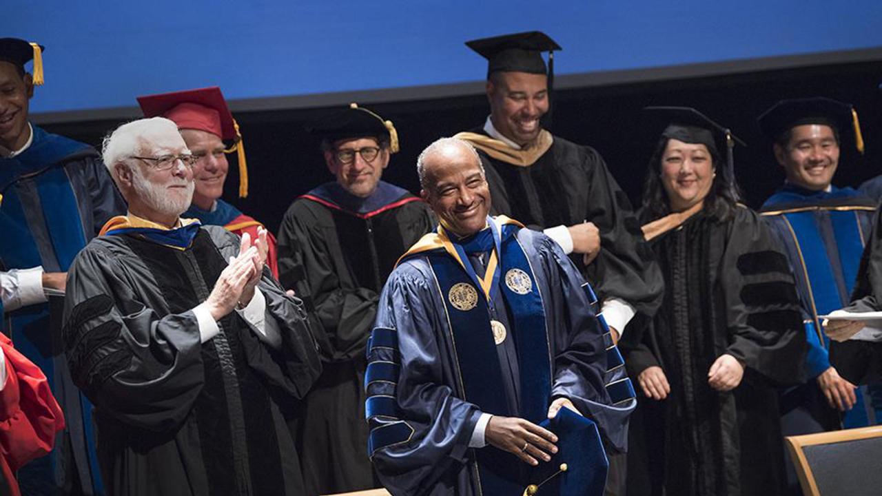 Chancellor May in academic regalia, at investiture