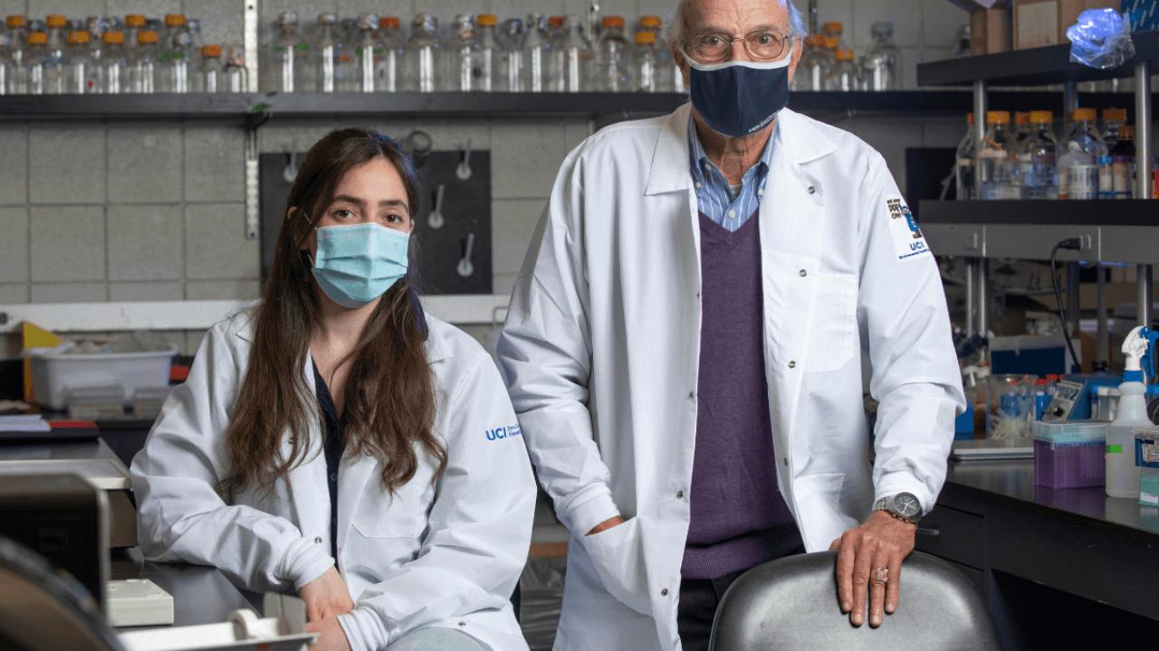 Woman and man in white lab coats