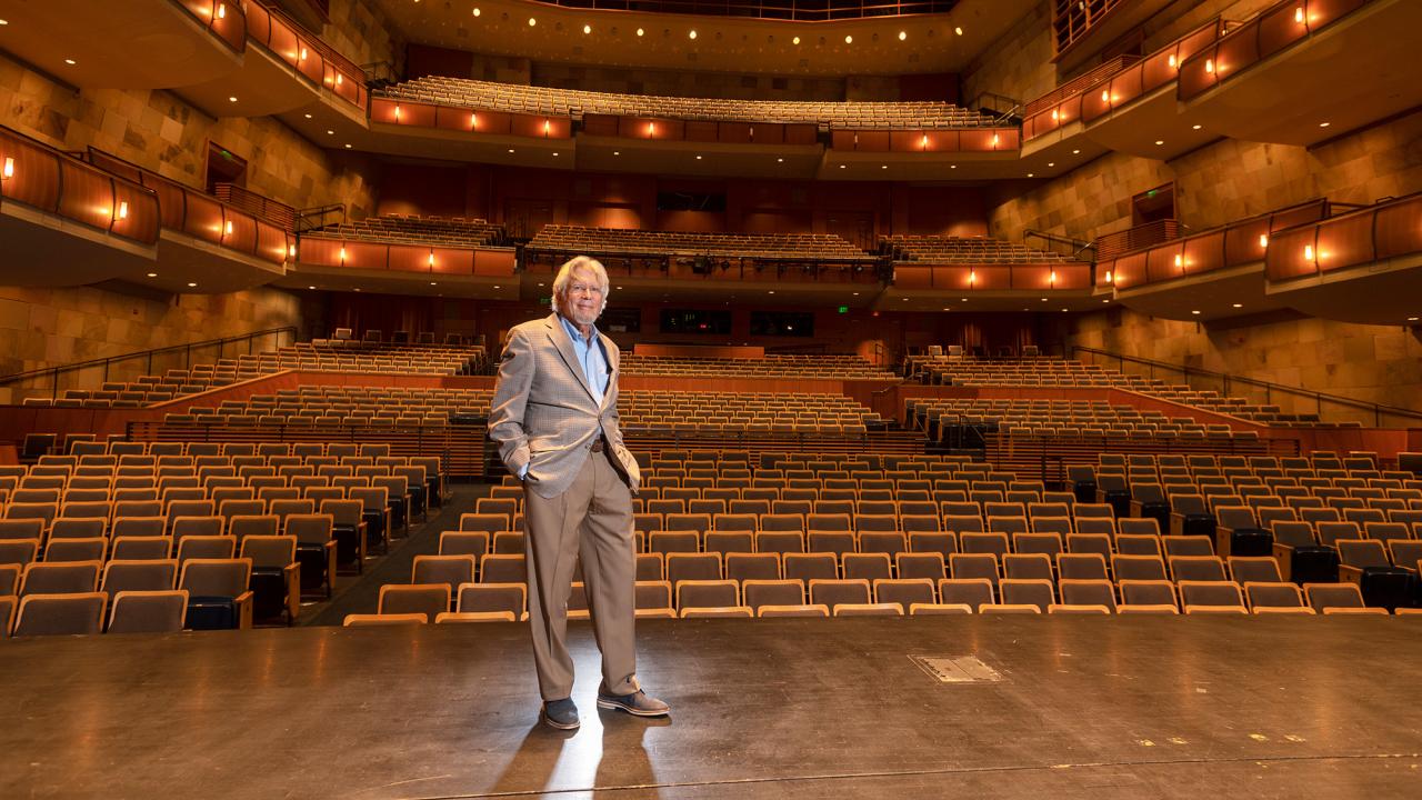 Don Roth, posing, on Mondavi Center stage