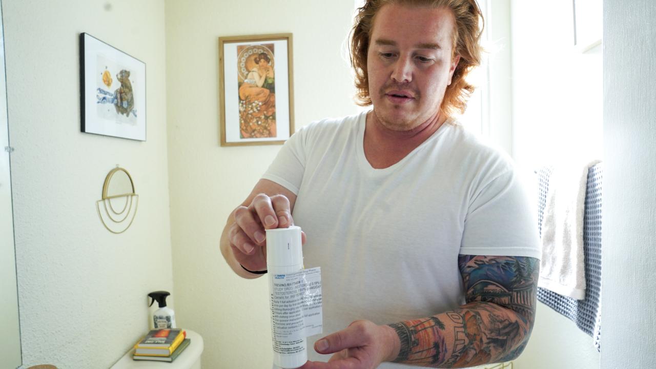 Matthew Treviño holds a canister of a hormonal birth control gel for men while in his home in Sacramento. He is part of a clinical trial at UC Davis Health testing the new drug. 