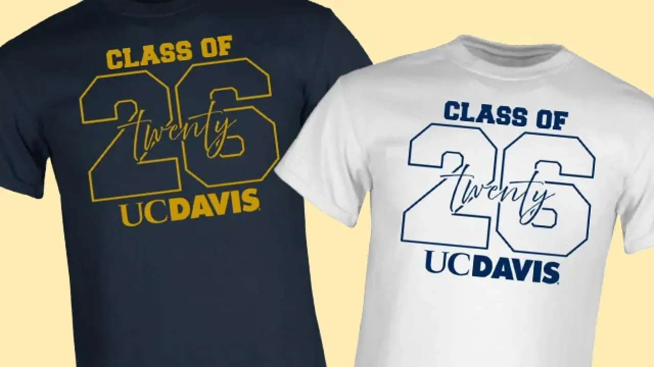 Two T-shirts reading Class of '26 UC Davis — navy with yellow, white with blue