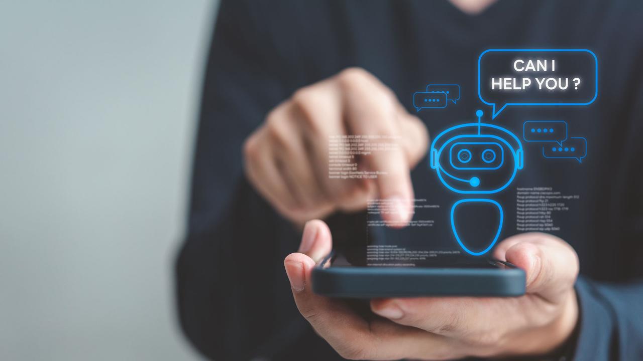 Hand tapping smartphone with floating blue chatbot graphic and chat bubbles
