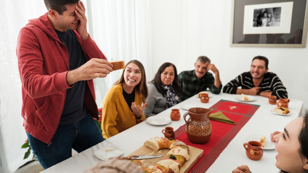 Family having cake at dinner table