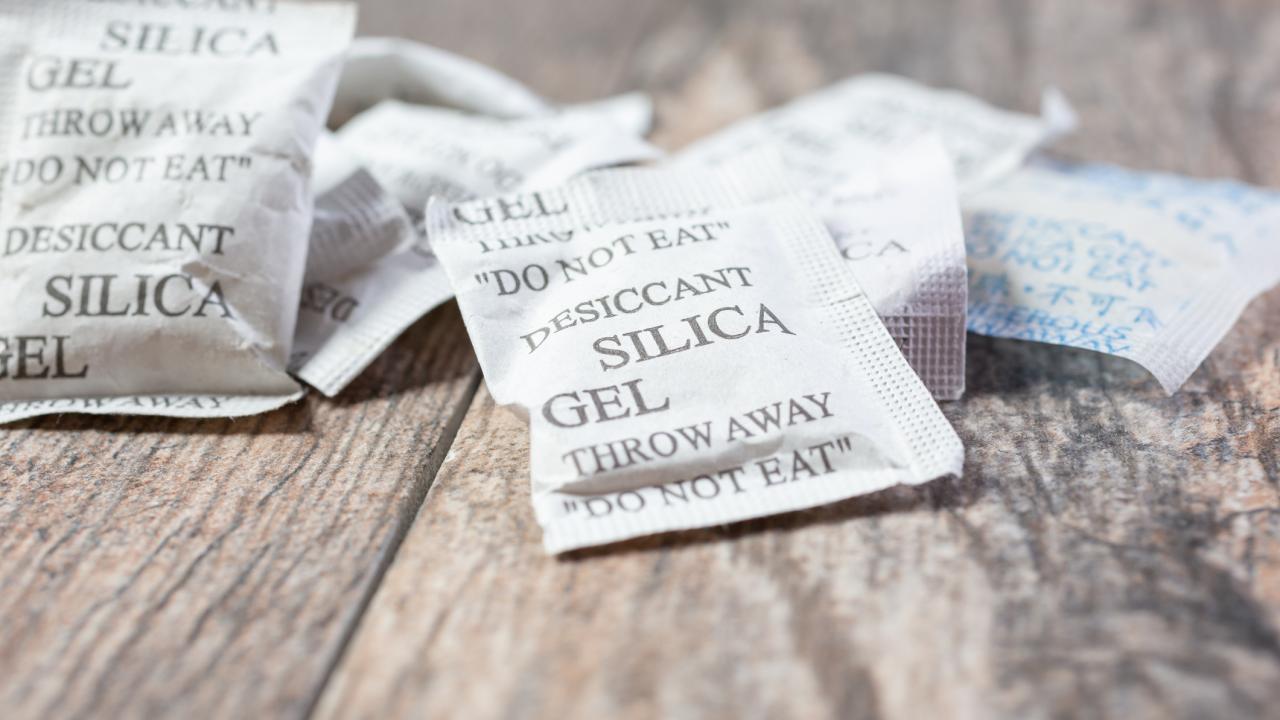 Silican gel packets on wood surface