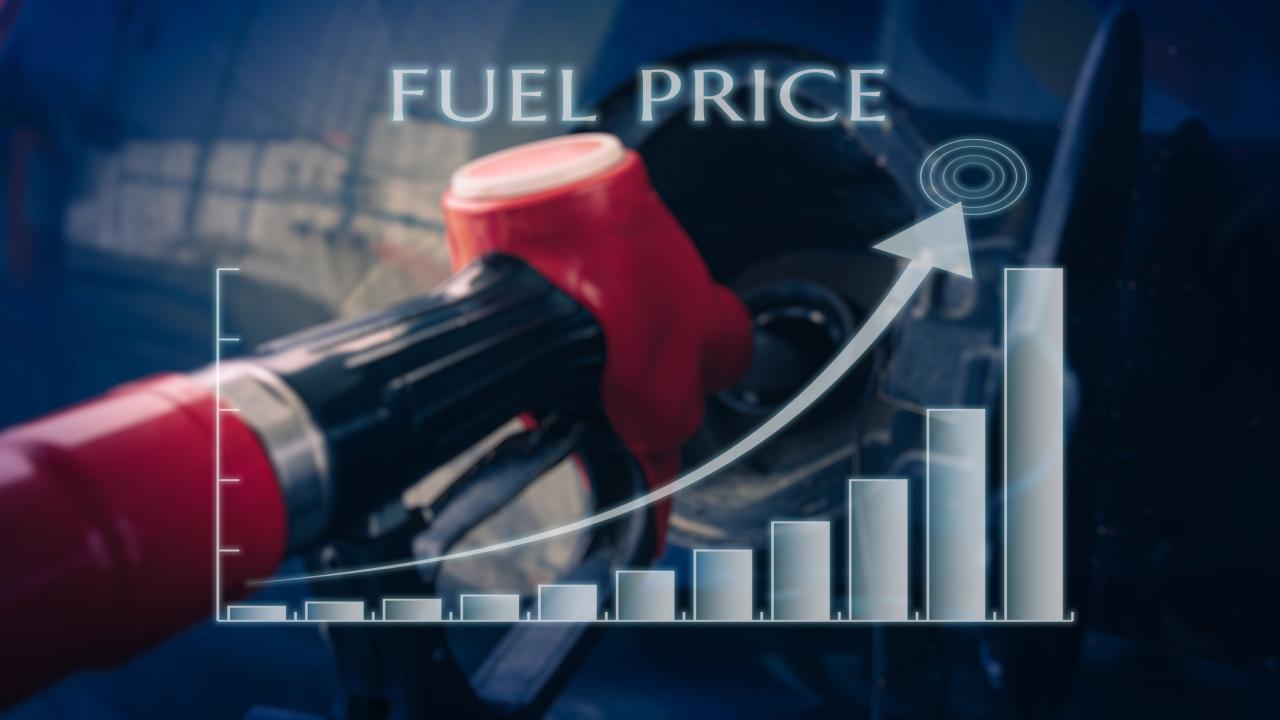 red gasoline nozzle with graphic showing arrow pointing upward