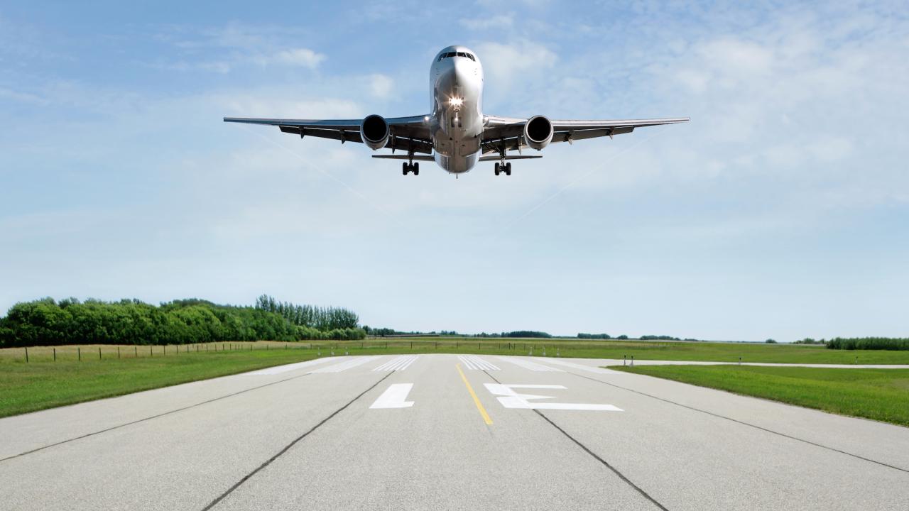 Airplane lands on runway