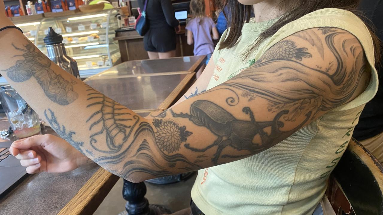 Mia Lippey's tattooed arm