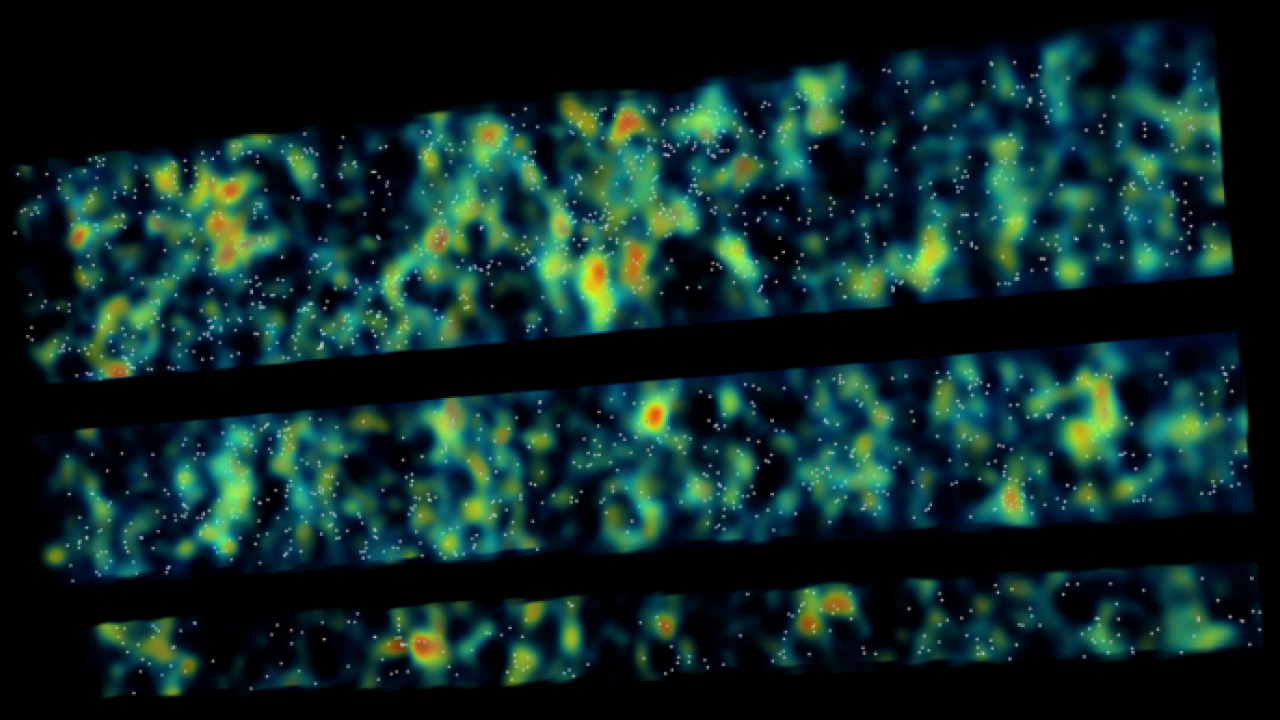 Bands of green, blue and red patterns across a black background 