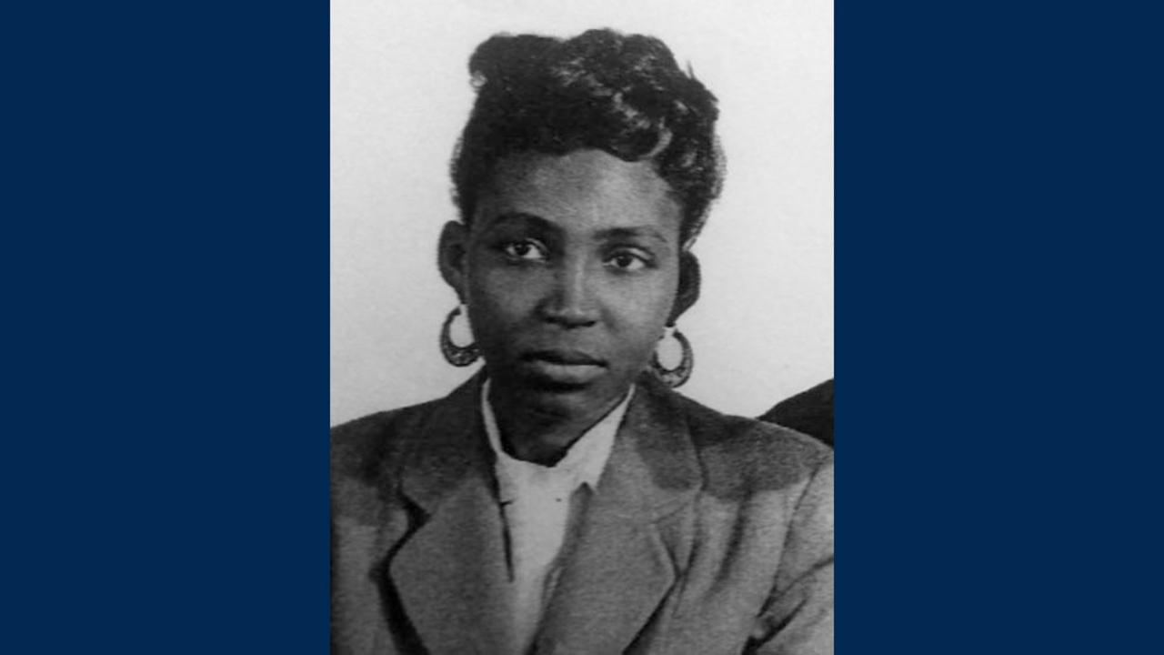 Dark-complected woman in black-and-white portrait photo 