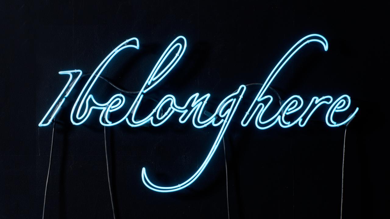 Neon blue writing on black background