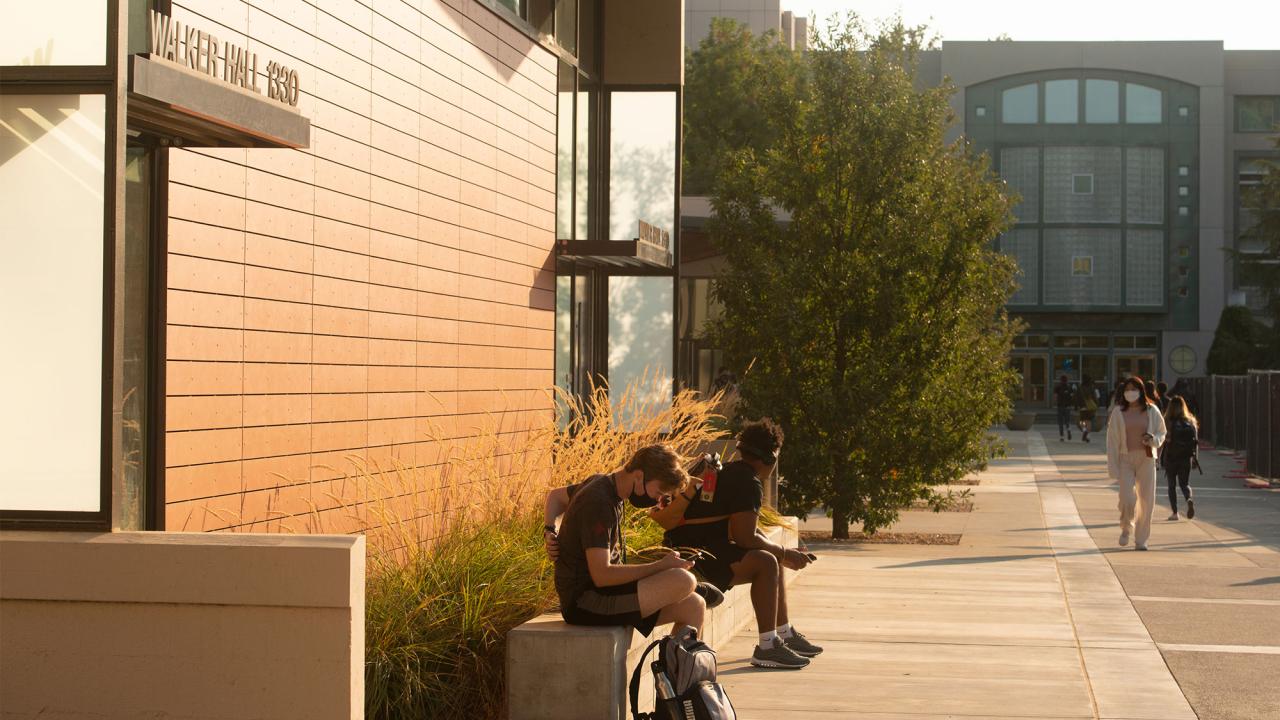 Students wit outside Walker Hall