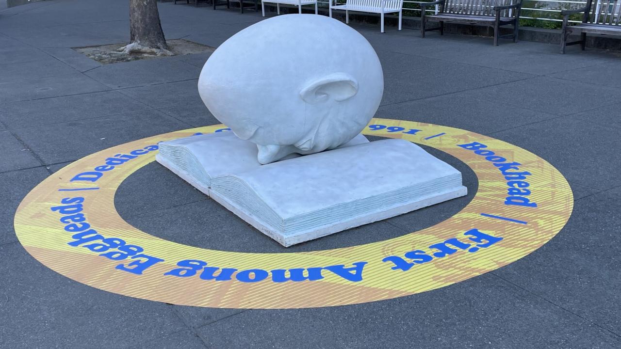 Bookhead with a ring-shaped floor decal that says Bookhead First Among Eggheads Installed October 1991