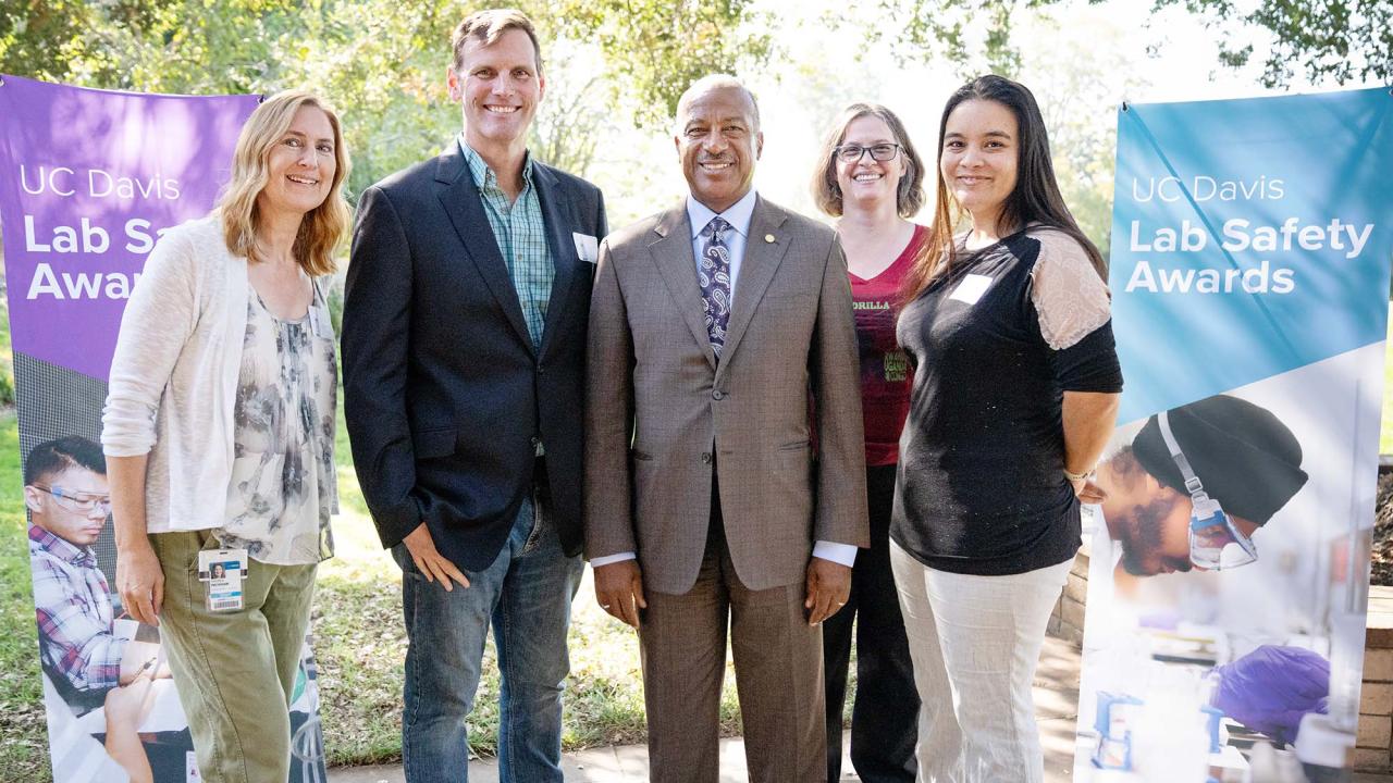 Award winners pose for photo with Chancellor Gary S. May.