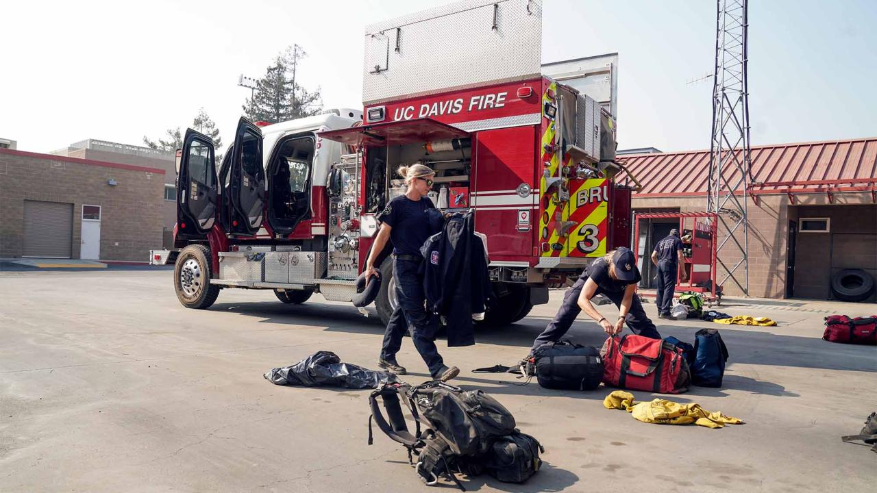 Firefighters unload Brush Truck 34 on campus.