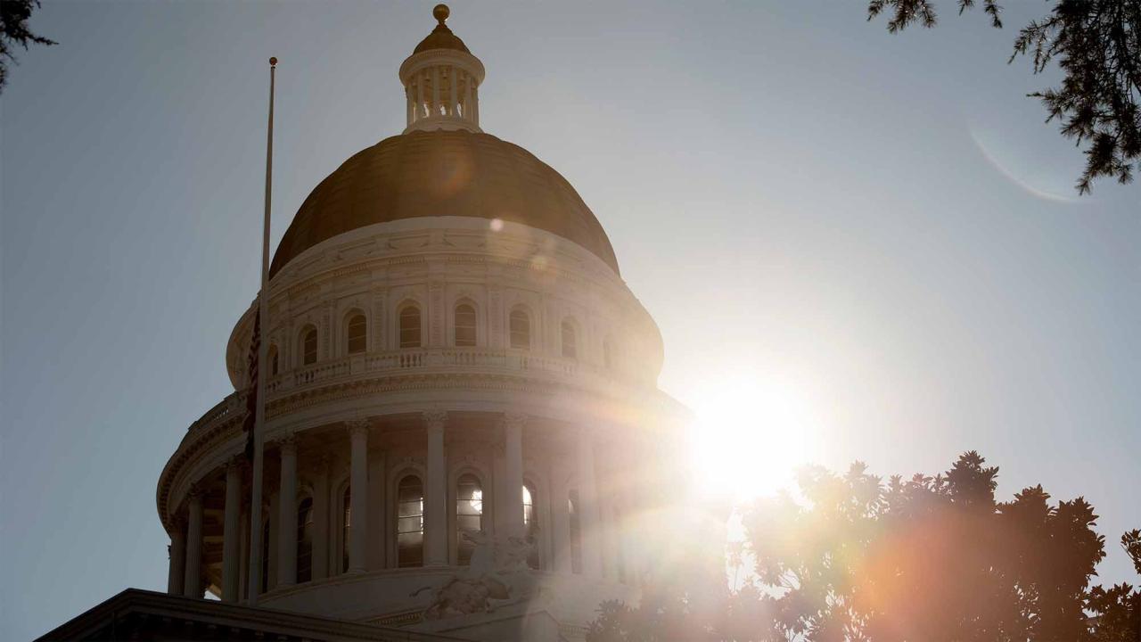 Sunlit California state Capitol building, photograph with sun flare