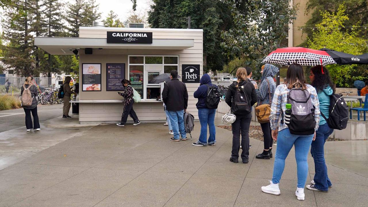 People stand in line at the California Hall Peet's Coffee.