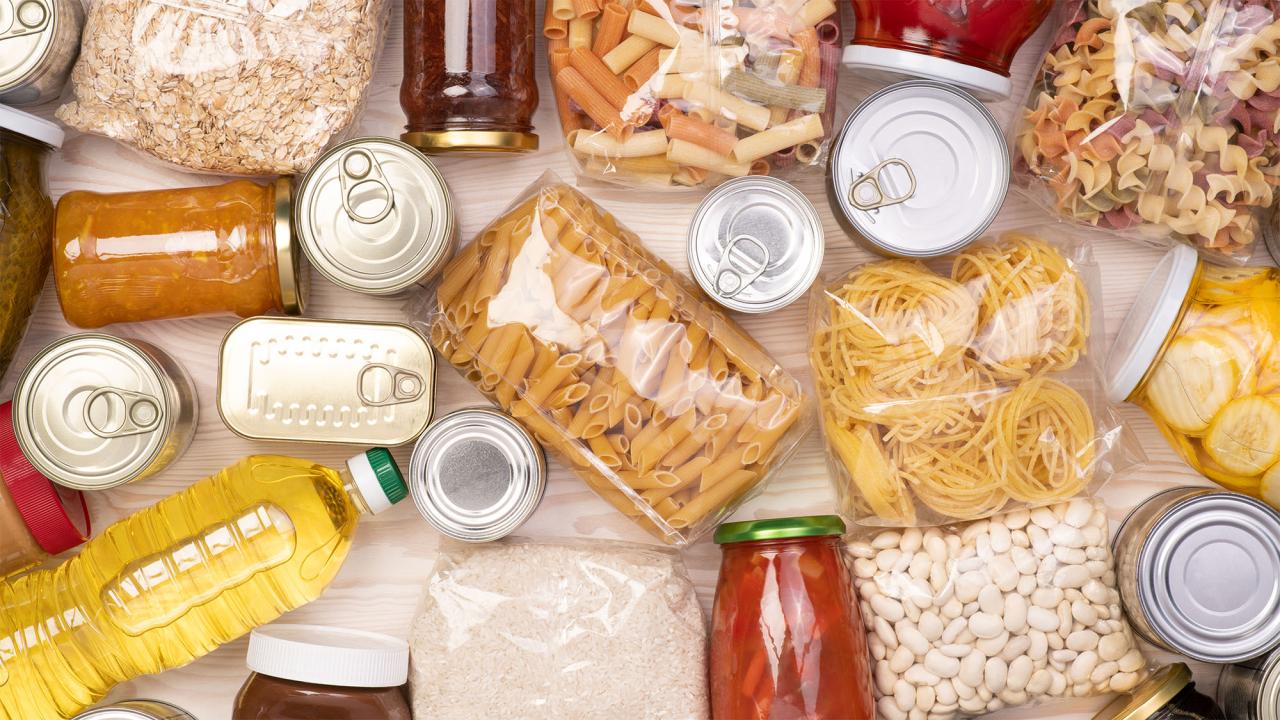 Assorted nonperishable foods: canned goods, jars, pasta, rice, and cooking oil