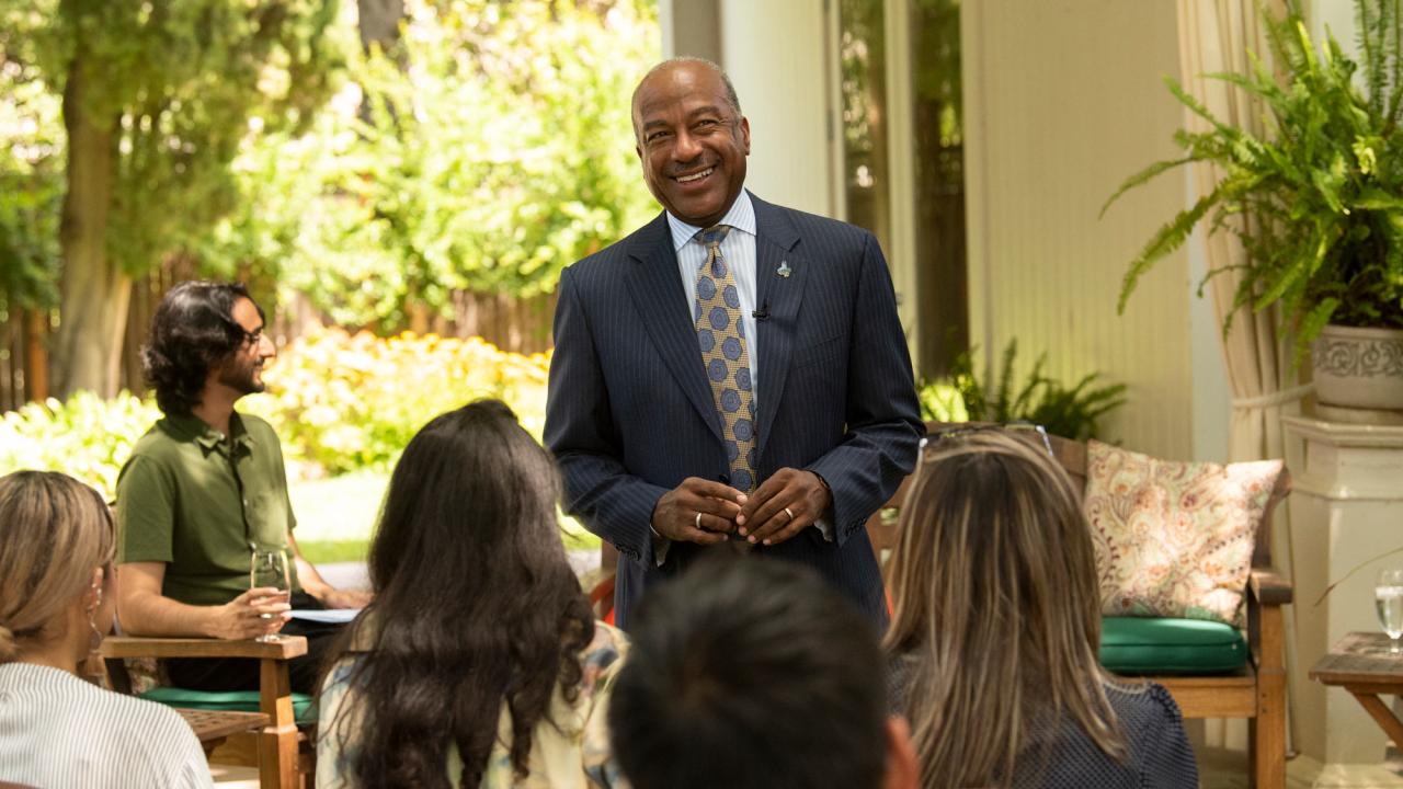 Chancellor Gary S. May addresses "Thursday Thoughts" audience, outdoors