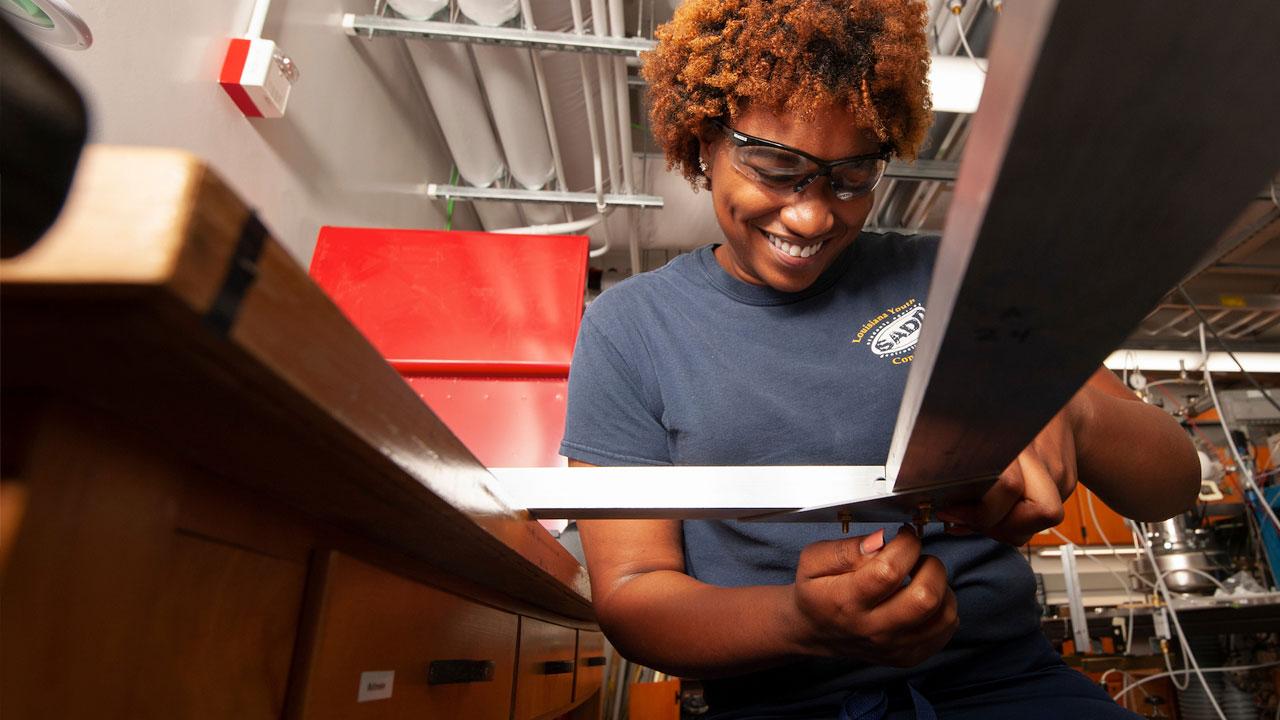 A female student works on her project in a chemistry lab