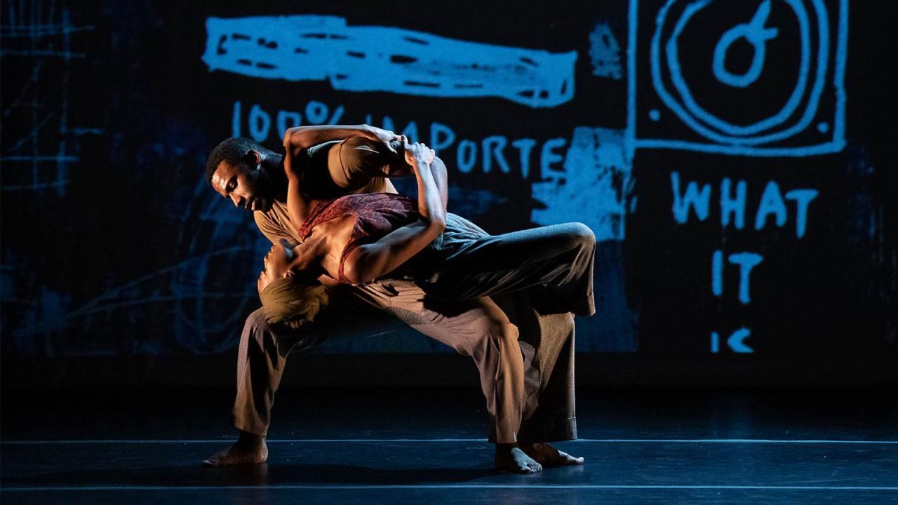 Dancers on dark stage