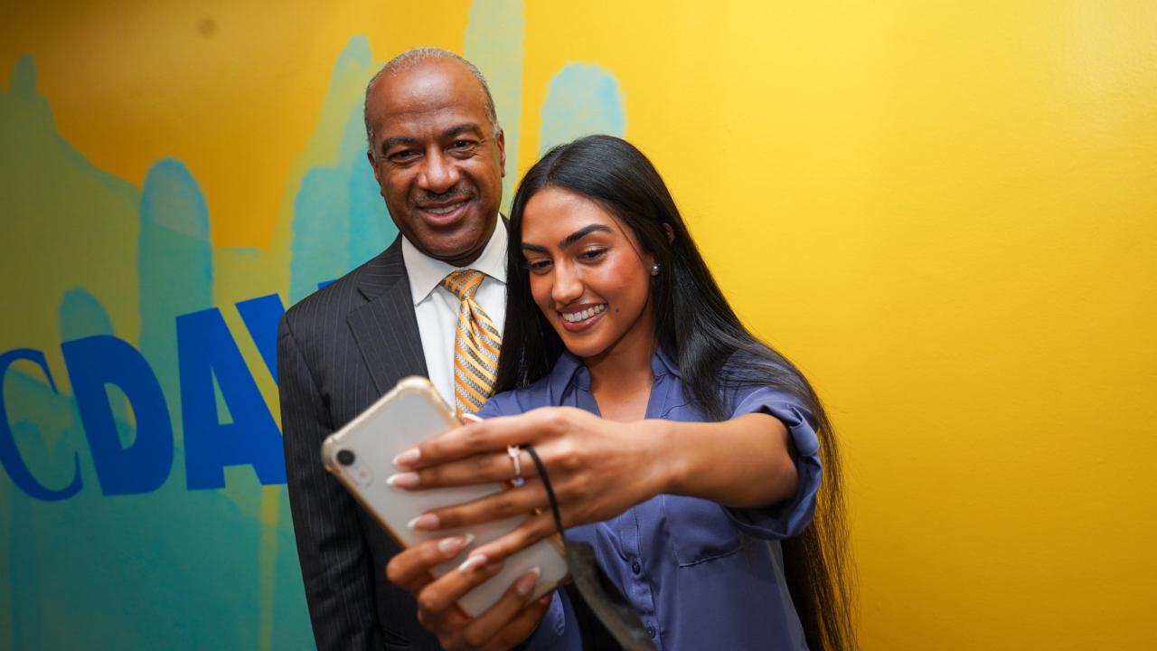 Chancellor May and female student, as she takes a selfie