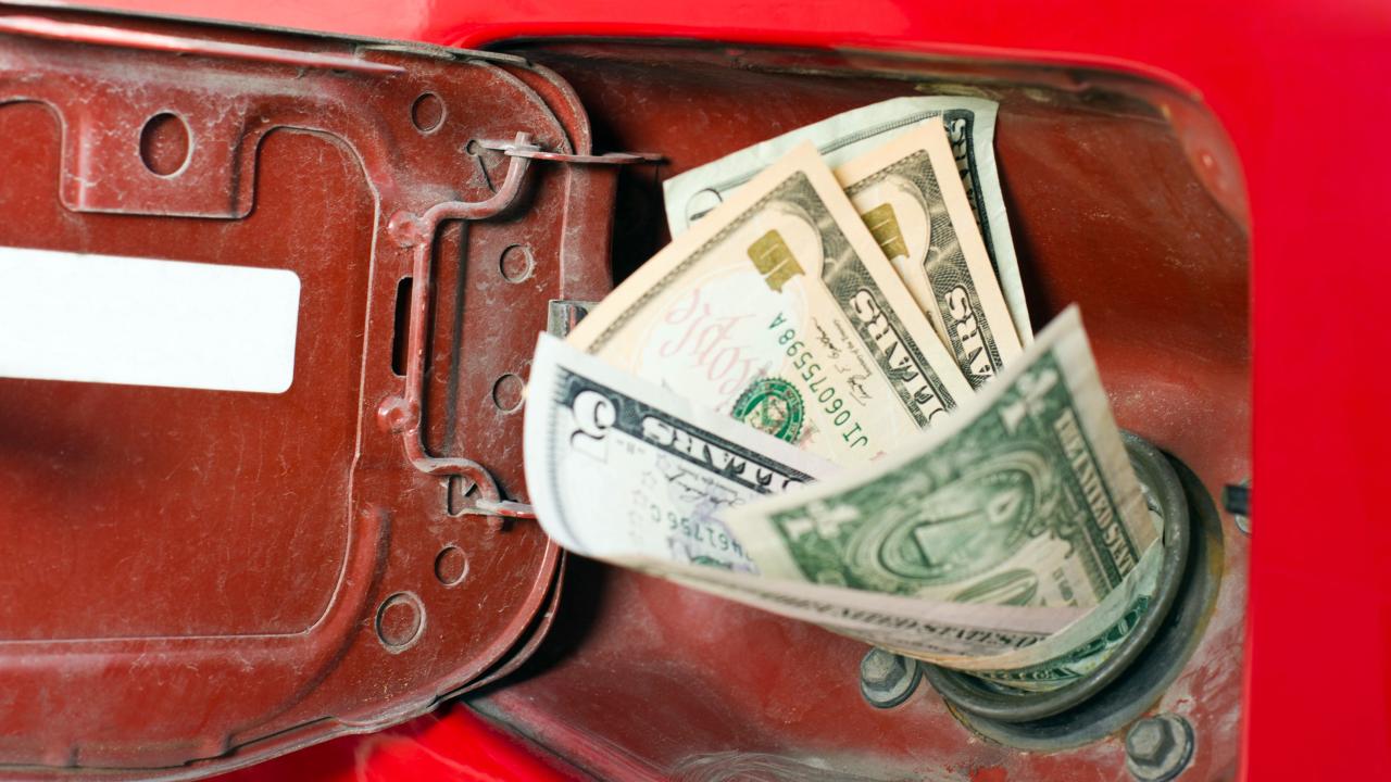 Cash going into gas tank 