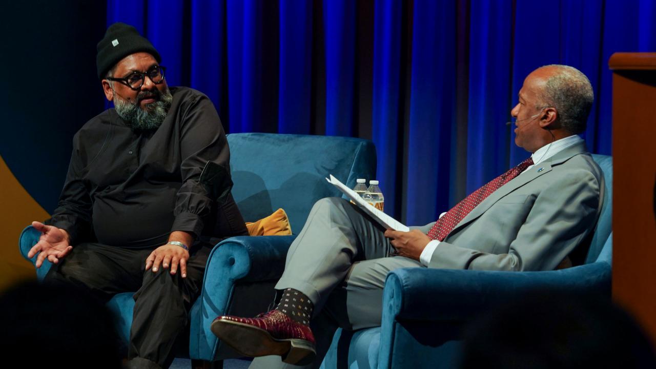 Joseph Patel and Chancellor Gary S. May on stage