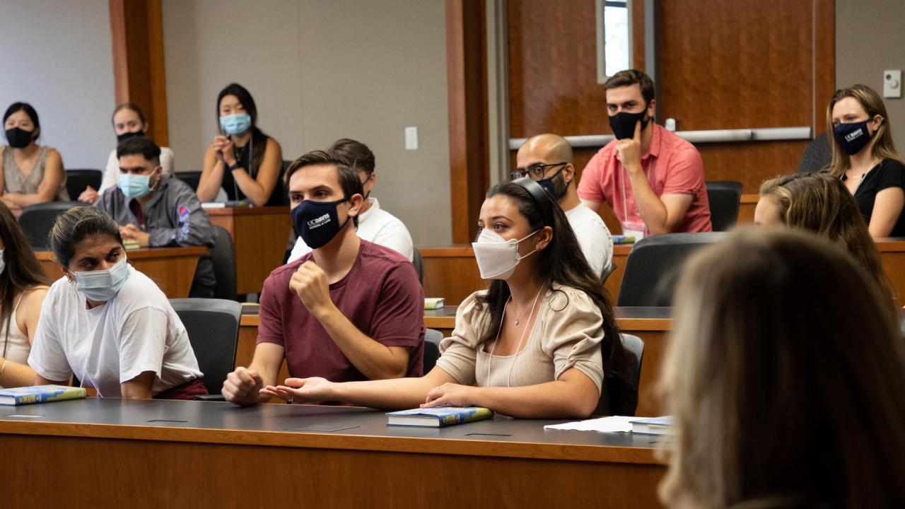 Students in masks in law school courtroom