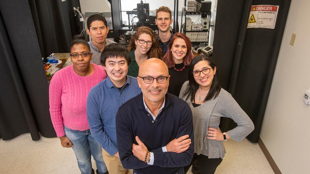 Lab team poses for portrait.