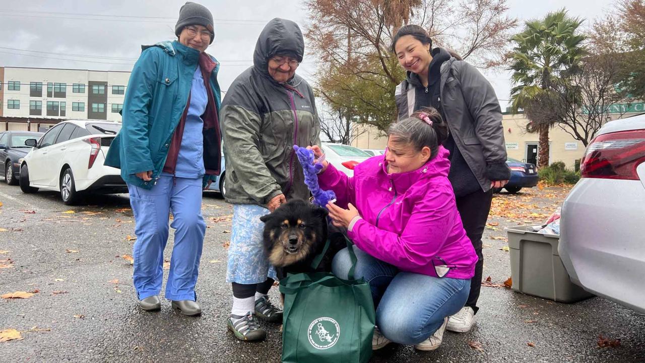 Pet owner and gift bag at Mercer Clinic