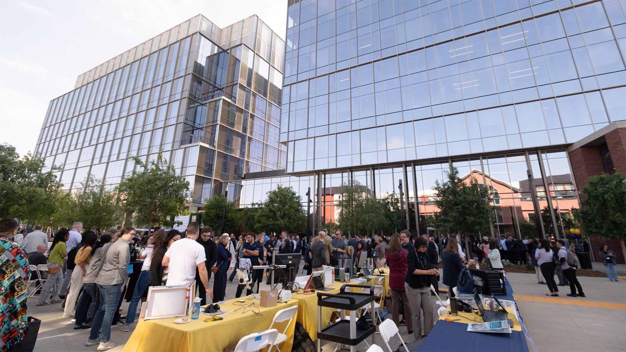 Crowd of people outside of Aggie Square building