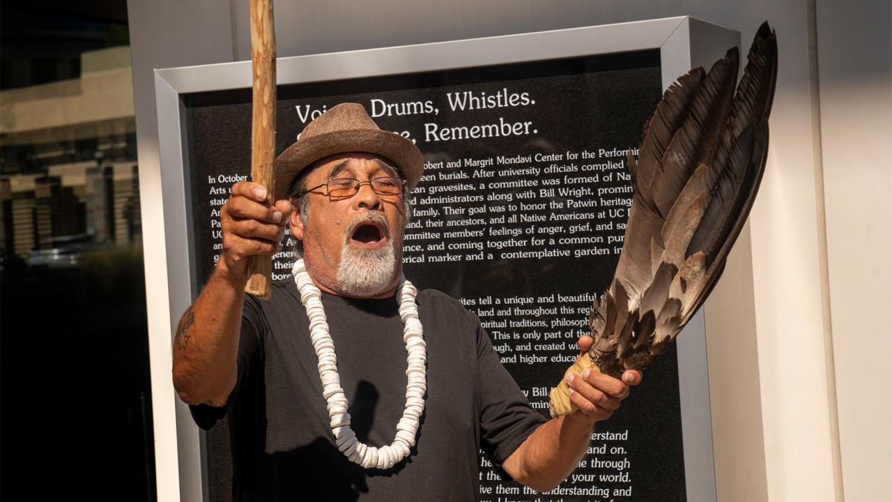 Man performs blessing in front of Mondavi Center