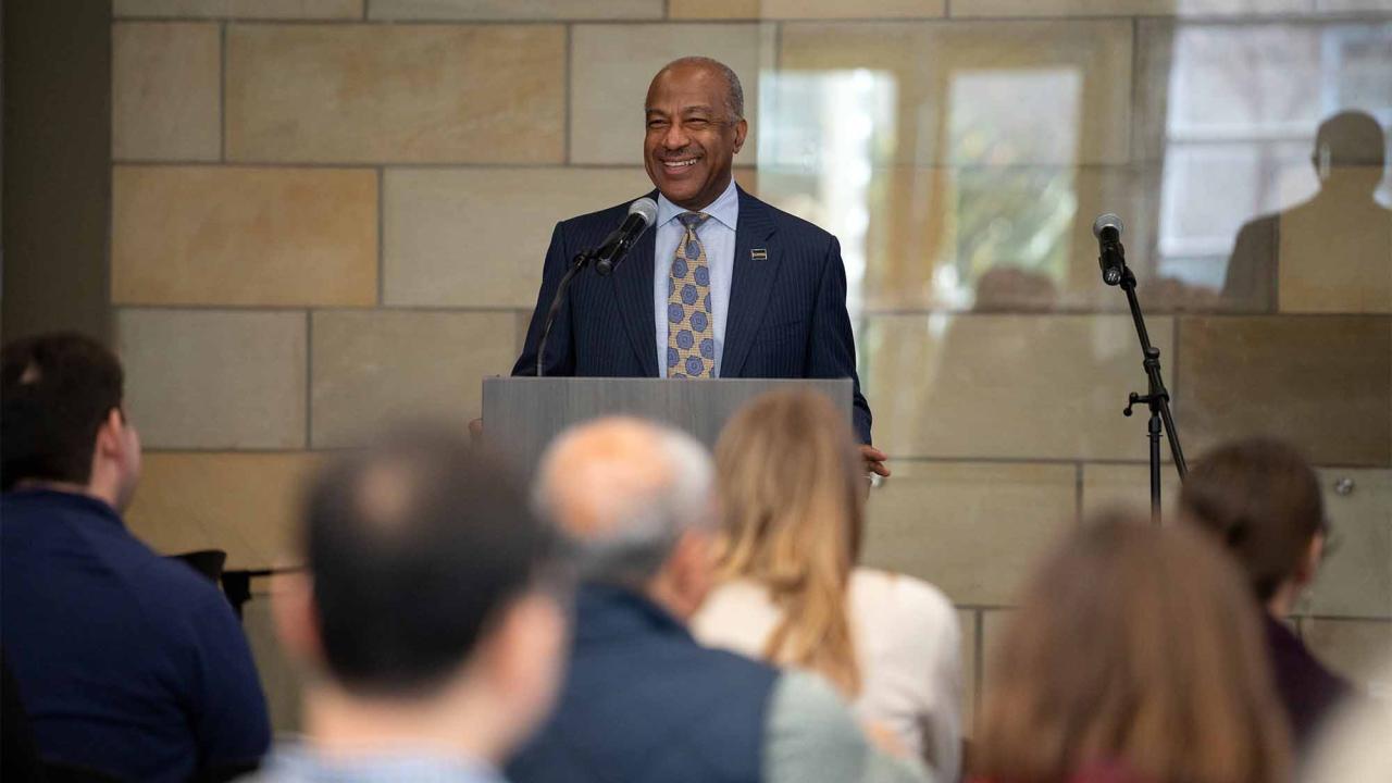 Chancellor Gary S. May speaks at lectern