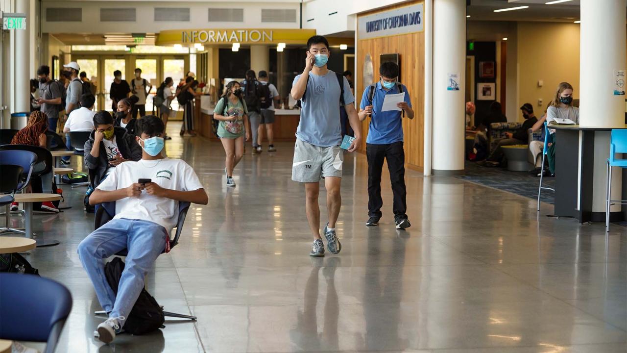 Students wear face coverings inside the Memorial Union.