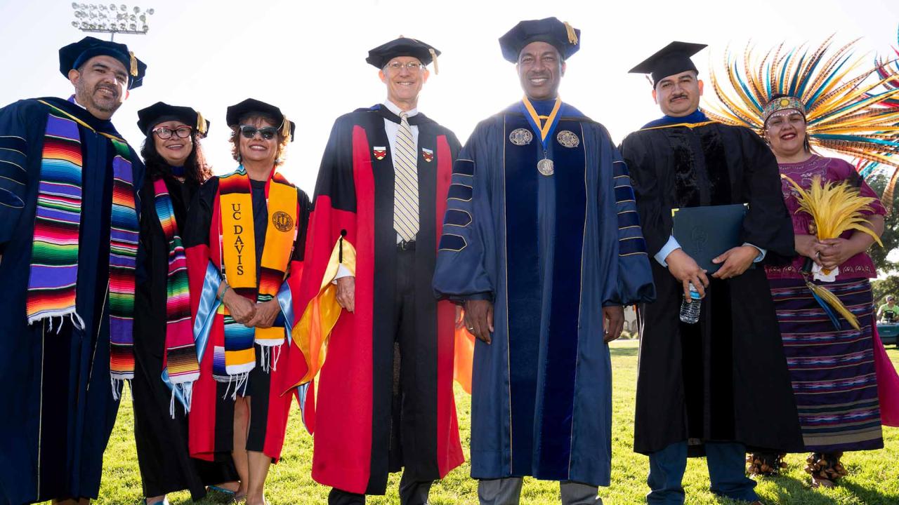 Group of faculty members pose for photo