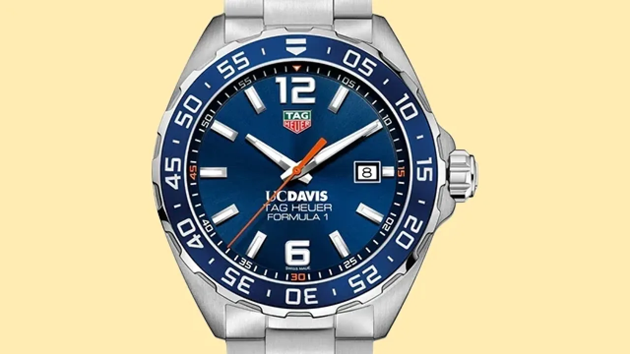 Stainless-steel dive watch with blue dial, bold 12/6 numerals and date on yellow background