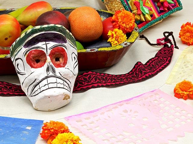 Artwork from dia de los muertos showing a skull