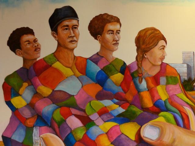 a mural with many cultures of people represented