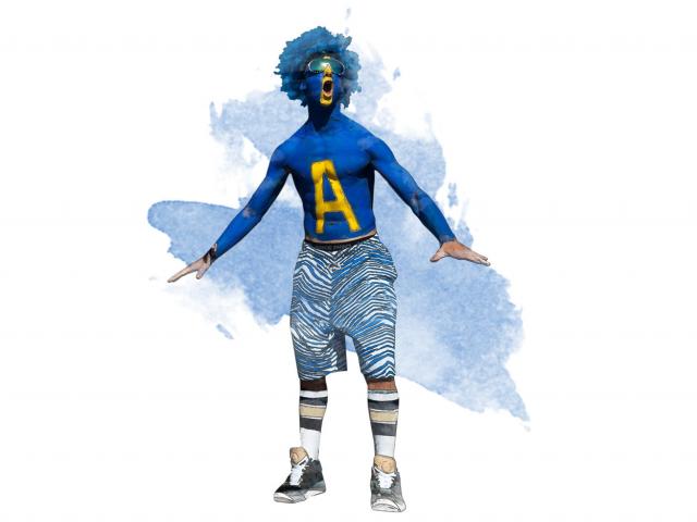 A UC Davis fan sports blue body paint and a blue wig to support the Aggies